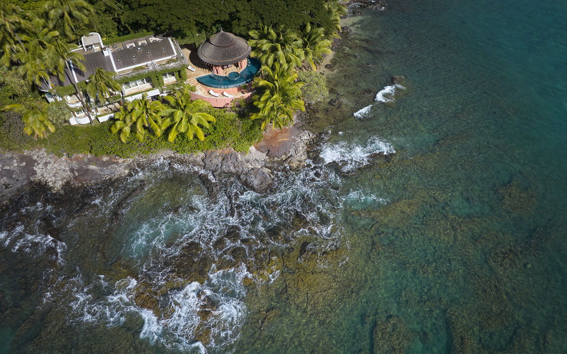 Aerial view of an oceanfront West Maui estate along the rocky coastline