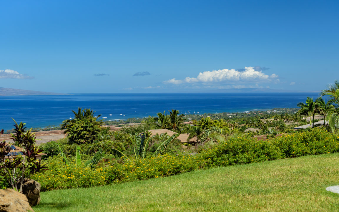 View over lawn and gardens toward the Launiupoko coastline and ocean